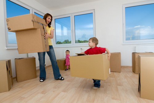 Family packing items for a move in Soho